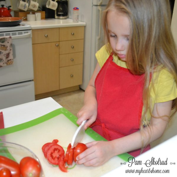 ketchup-making-nora-cutting-tomatoes